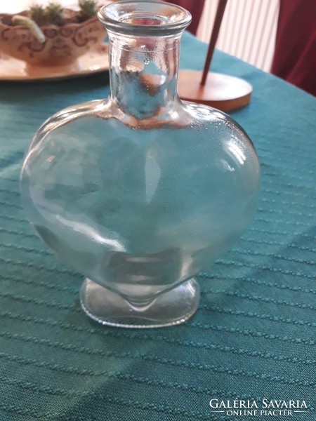 Thick glass bottle in heart shape