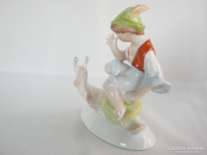 A boy traveling on a snail-back porcelain from the Drasche quarries