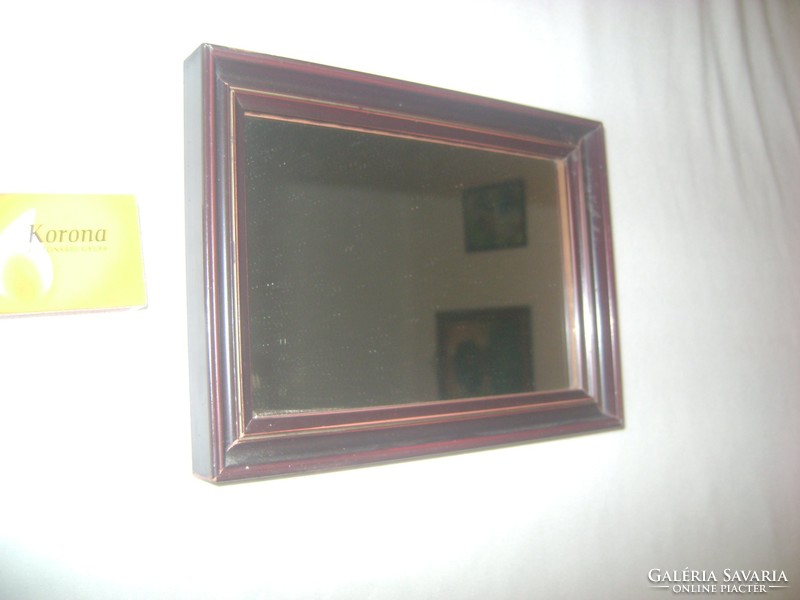 Small wall mirror with wooden frame, shaving mirror