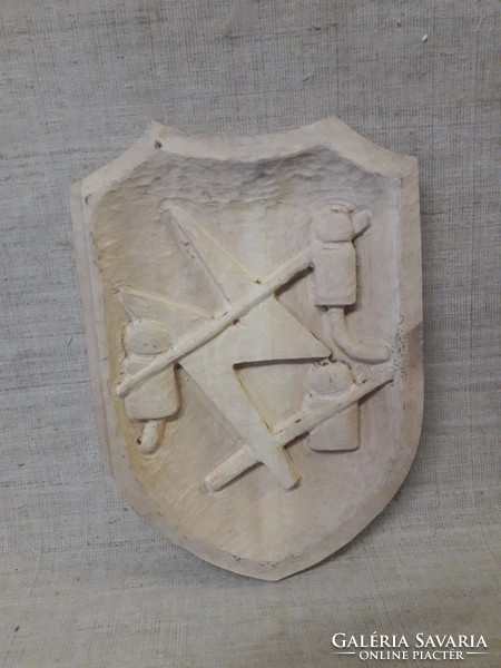 Carved shield.