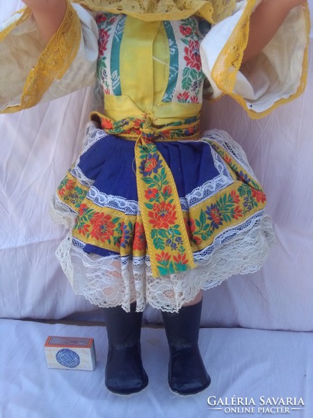 Old sleeping baby in folk costume with laced hair - 54 cm