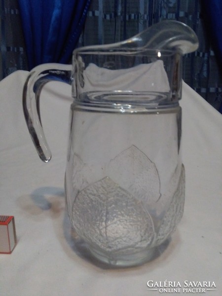 Glass jug decorated with convex leaves