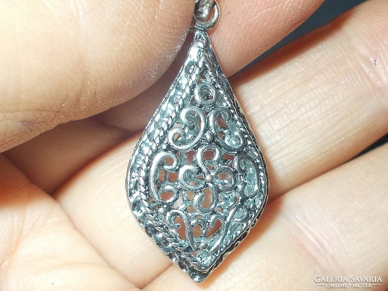 Old Tibetan silver pendant with openwork pattern
