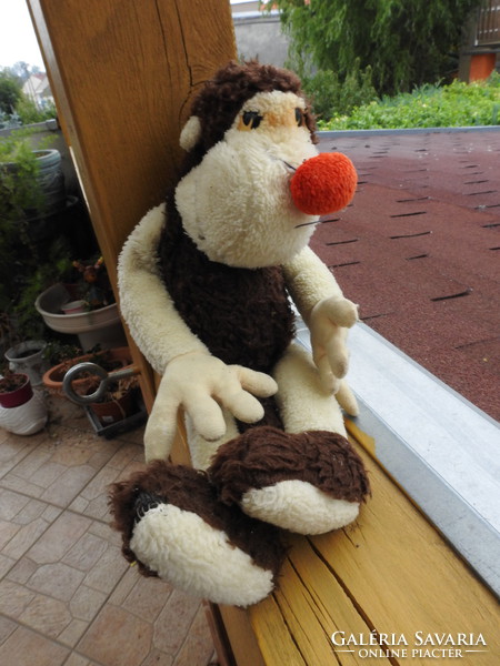 Old monkey plush figurine