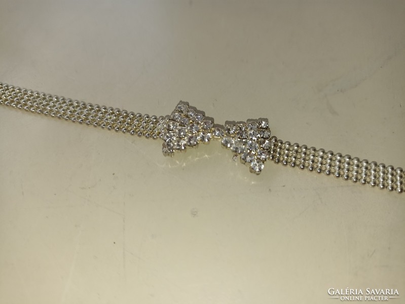 Jewelry bracelet with bow decorated with zircon stones