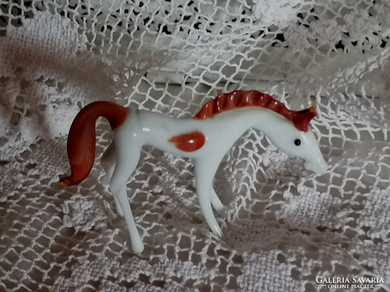 Graceful, white glass foal, pony