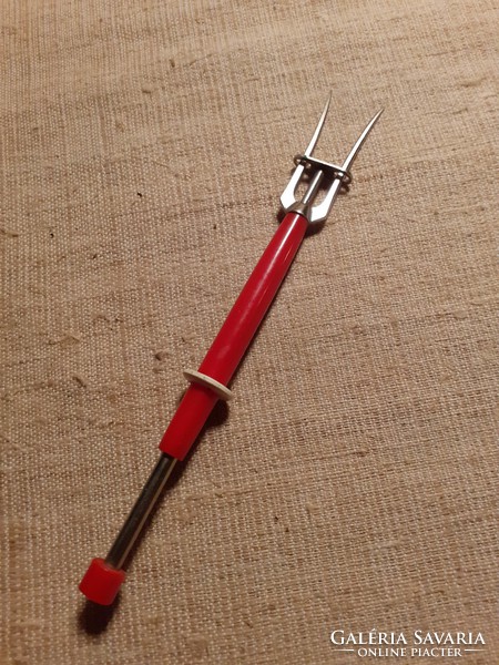 Nice condition spring meat needle with red plastic handle