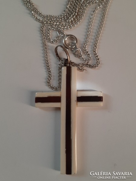 Bone ebony cross on a silver chain!