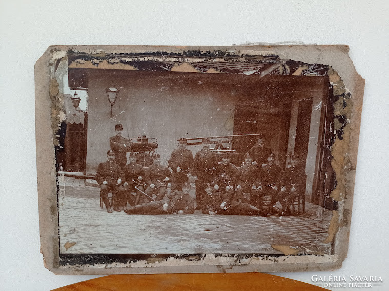 Damaged large photo of an antique Hungarian firefighter depicting firefighters