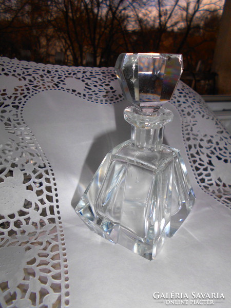 Polished glass bottle with polished stopper.