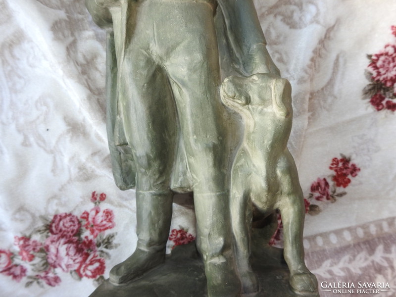 The terracotta sculpture of Zoltán Szőke - with his hunter dog - is a small sculpture