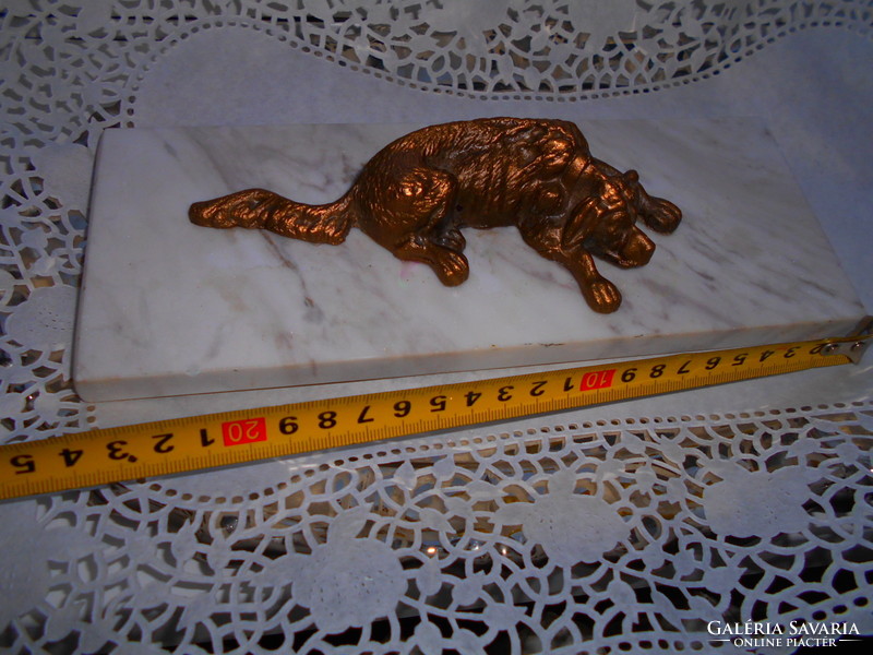 Bronze dog sculpture on marble soles