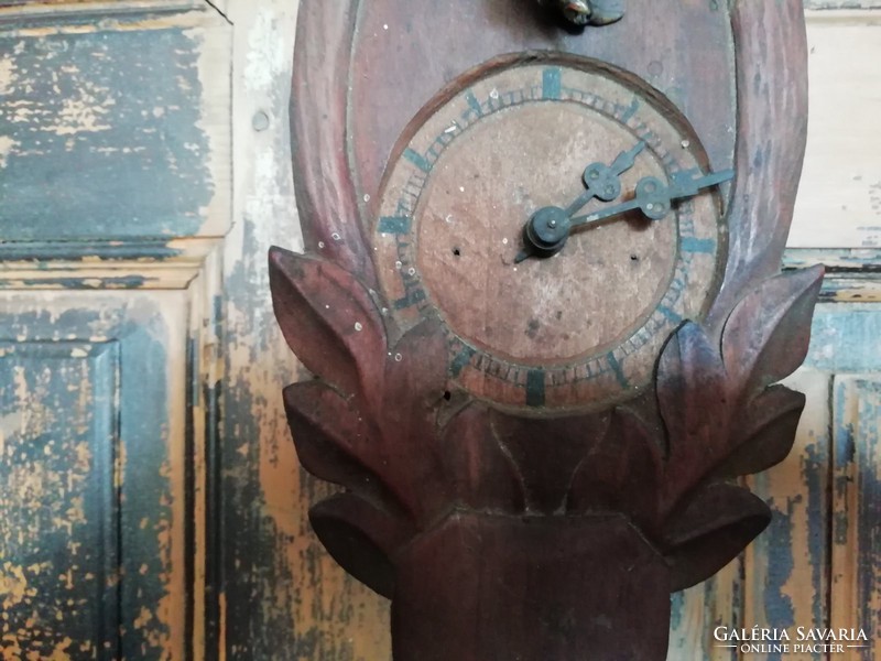 Rare carved clock on antique peasant clock in Black Forest