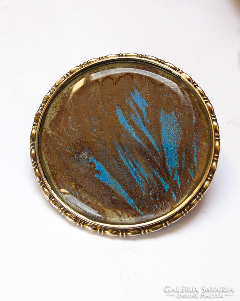 Viennese gilded silver brooch with azure butterfly wing decoration.