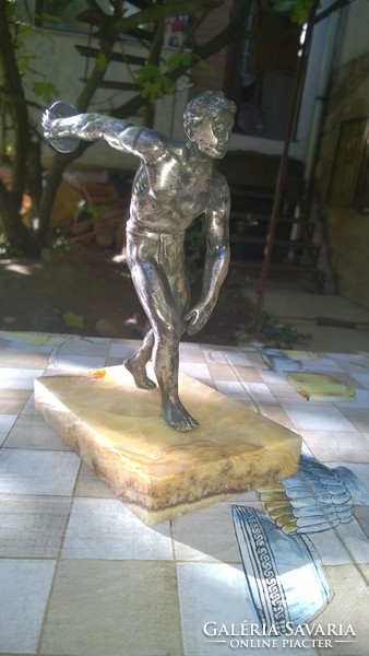 Discus thrower statue on a marble base