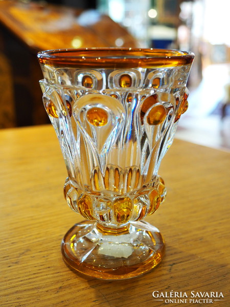 Glass cup decorated with a drop pattern