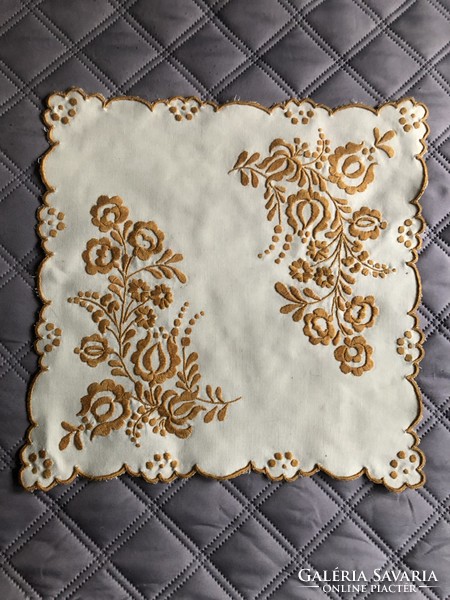 Hand embroidered on a pale yellow background mustard color matyo pattern small tablecloth 33 cm