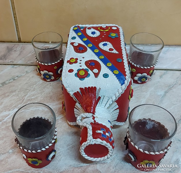 Set of handcrafted liqueurs covered with colored leather.