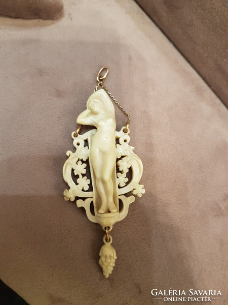 Bone pendant with a tiny gold chain
