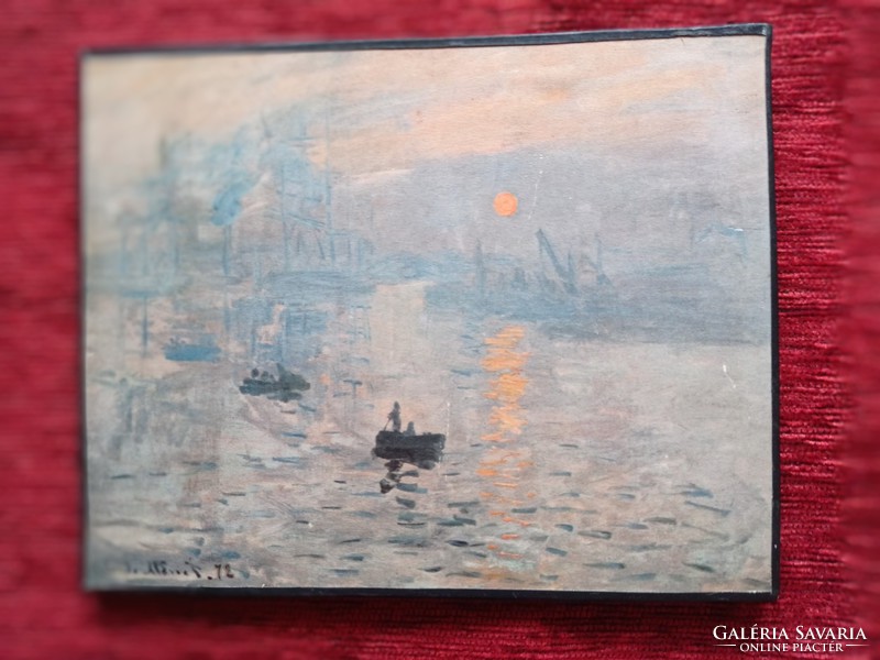 A print of Claude Monet's painting of the rising sun
