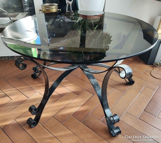 Glass table with hand forged plinth