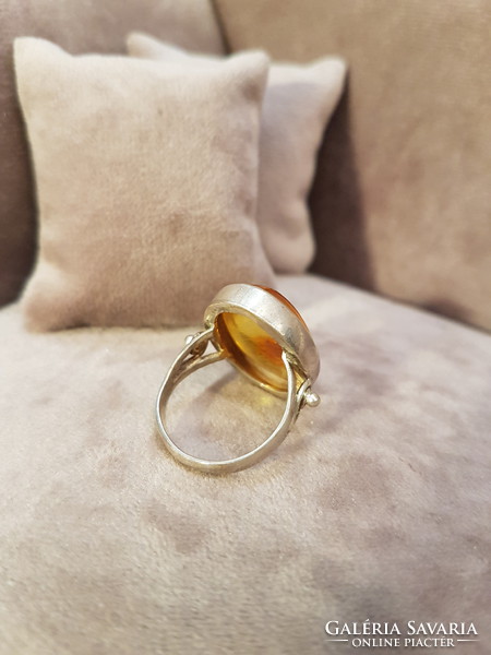Silver ring with polish amber