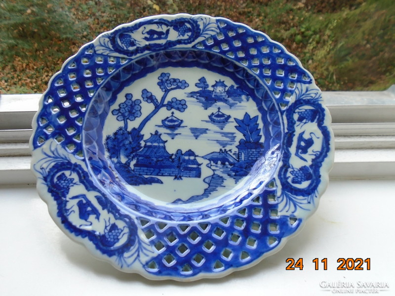 Chinese plate with hand-painted, hand-marked cobalt blue willow pattern, celadon glaze, pierced rim