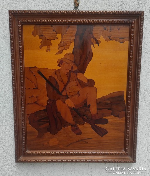 Marquetry picture with a hunting rifle under a tree! Nicely done!