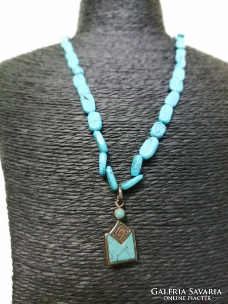 Turquoise mineral necklace with silver pendant