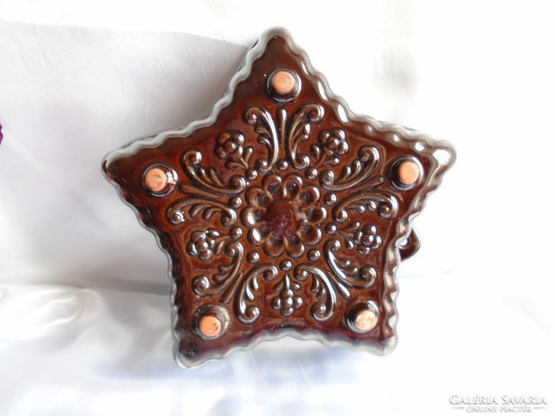 Star-shaped, beautifully patterned glazed ceramic baking dish.