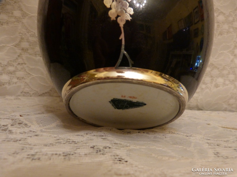 Porcelain vase with silver insert.