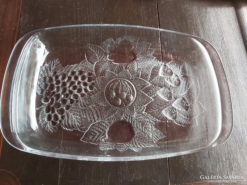 Beautiful glass fruit pattern in glass bowl with strawberry grapes cherries in baking dish on center table