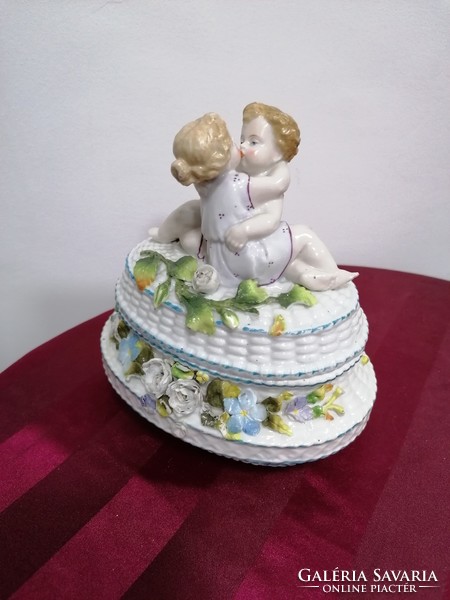Old porcelain bonbonier with figural decoration