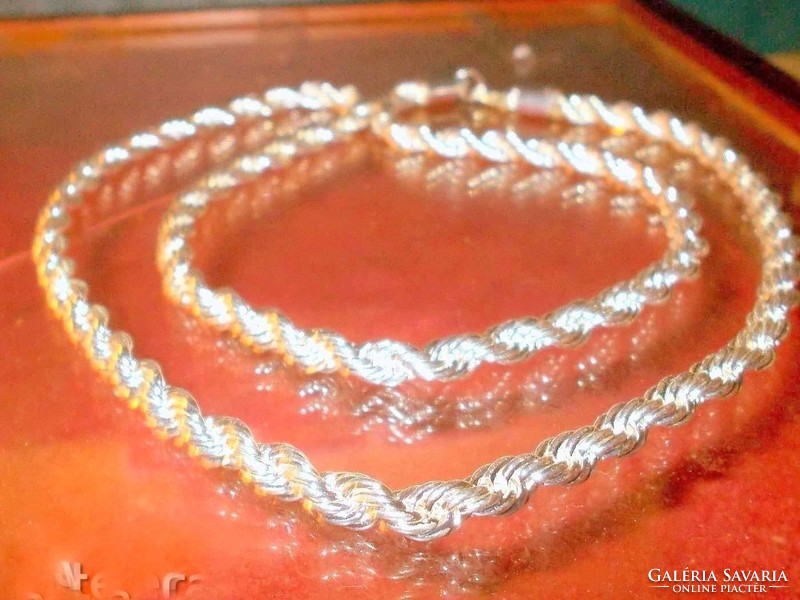 Serious braided like. Marked 925 filled silver necklace 72 cm and 0.7 Cm