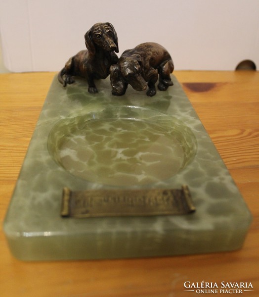 Dachshunds on a marble pedestal