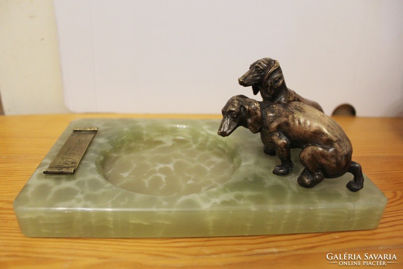 Dachshunds on a marble pedestal