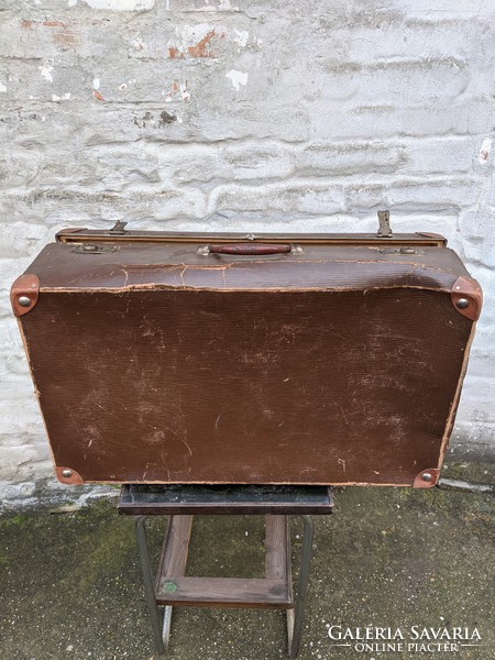 Vintage suitcase with leather strap