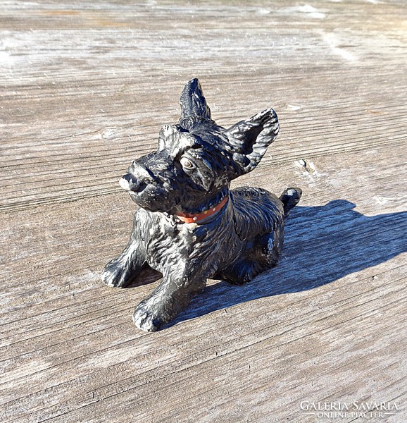 Old dog statue and matches in ashtray