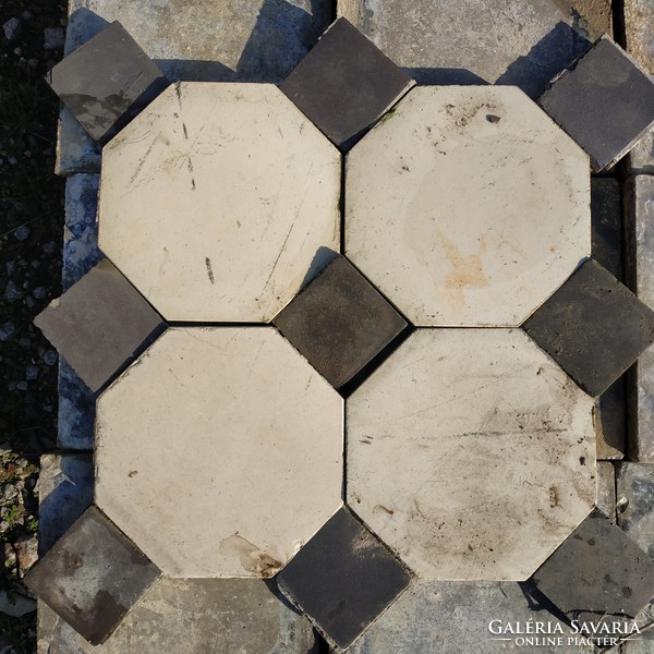 White-butter octagonal ceramic tile covering with black companion