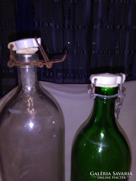 Two pieces of old buckled glass - green, white - together