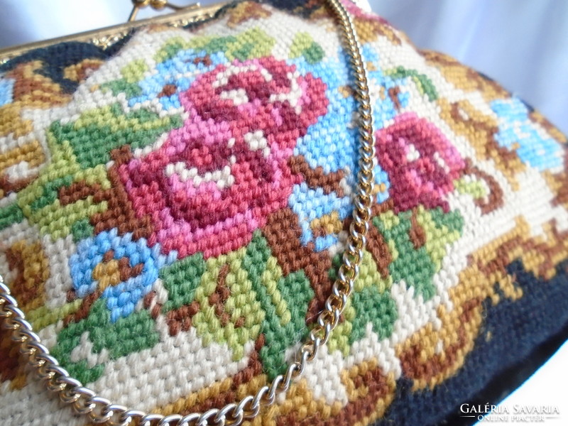 Tapestry bag. Colorful roses and flowers on a black background.
