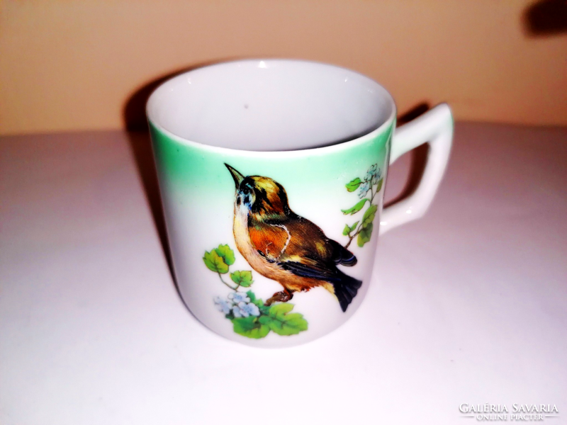 Antique birdie collecting coffee cup