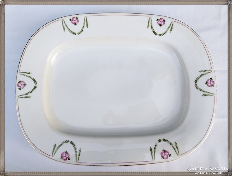 Large, antique, thick-walled porcelain bowl with a rosy garland pattern.