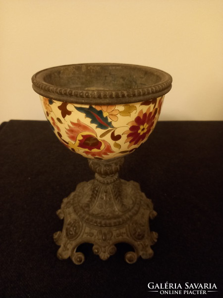 Presumably the bottom of a lamp or a tin goblet with historic enamel decoration