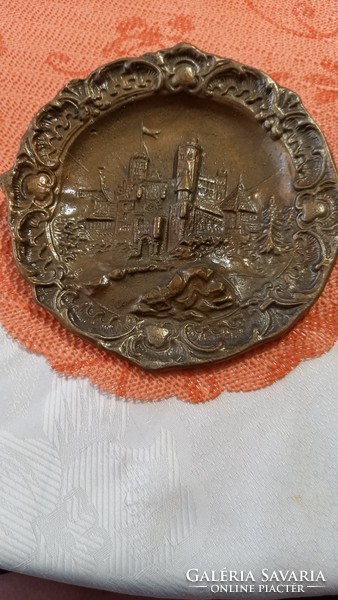 Brass relief depicting a castle, cast wall decoration