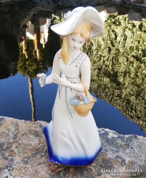 Beautiful arpo porcelain lady with floral basket collecting pieces of nostalgia pieces