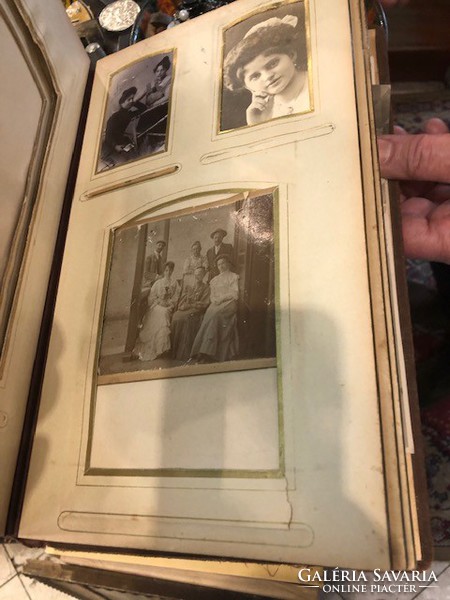 Leather photo album, snapped book with old photos, 45 x 30 cm.