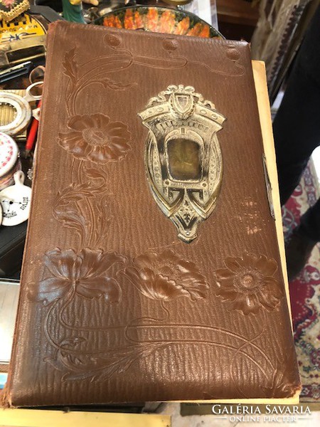 Leather photo album, snapped book with old photos, 45 x 30 cm.