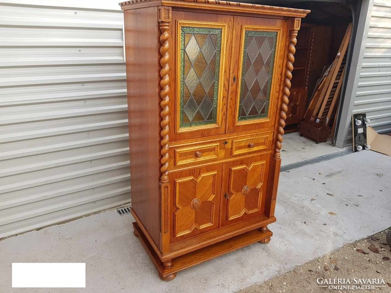 The extra large lead-in colonial bar cabinet is for sale.