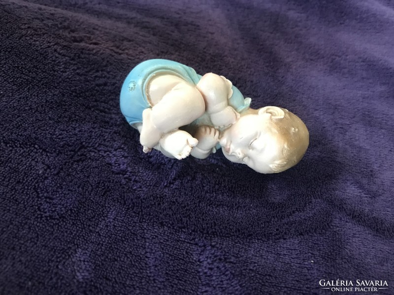 A. Lucchesi is a well-known baby figure with a baby statue on a sleeping baby tooth